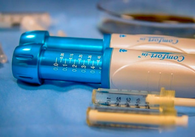 A close up of the Comfort-In anaesthetic tool