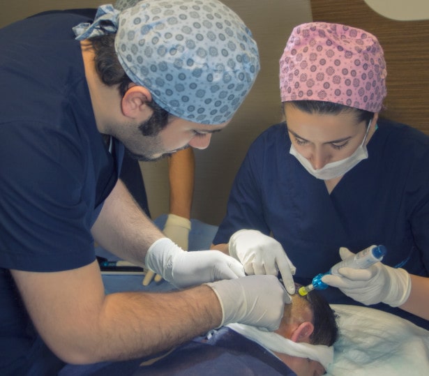 Dr Balwi and his medial team applying a local anaesthetic to a patient