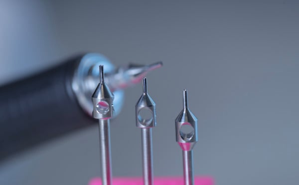 The FUE hair transplant uses a motorised tool