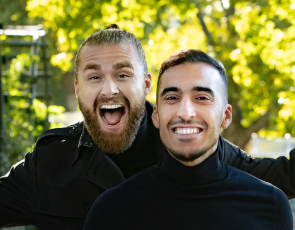 Two happy men after a DHI hair transplant