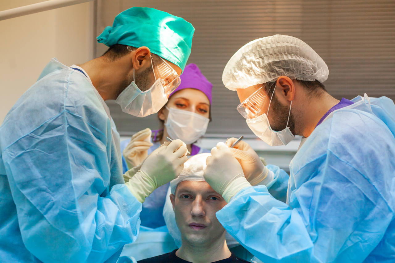 A hair transplant patient having his hair restoration surgery