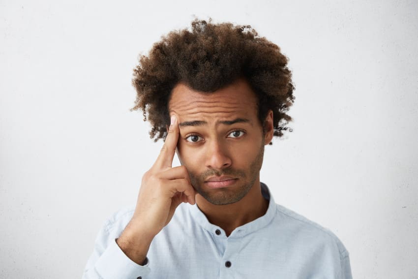 Man afro hair is worried about his receding hairline
